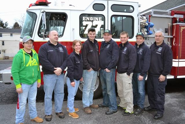 54 crew in front of Engine 77